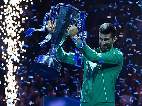 Serbia's Novak Djokovic poses with the trophy after winning the final against Italy's Jannik Sinner at the ATP Finals in Turin on Sunday.