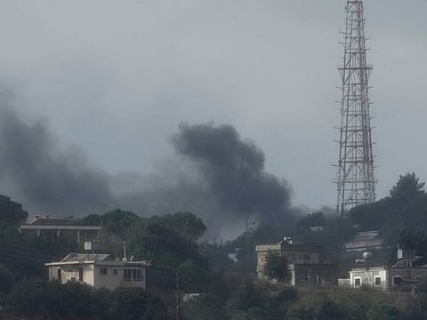 Black smoke rises from an Israeli army position which was hit by Hezbollah heavy missiles, as it was seen from Rmeish, a Lebanese border village with Israel in south Lebanon, on November 20, 2023.