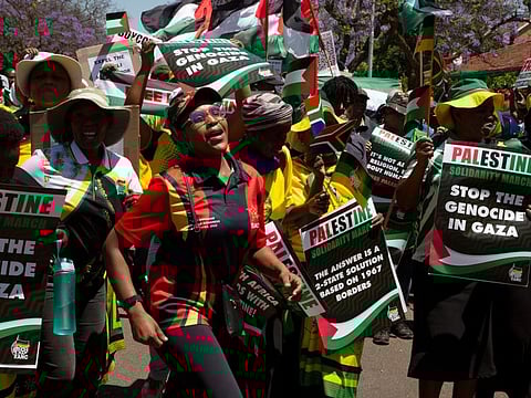 Palestinian supporters demonstrate at the entrance to the Israeli embassy in Pretoria on October 20, 2023.