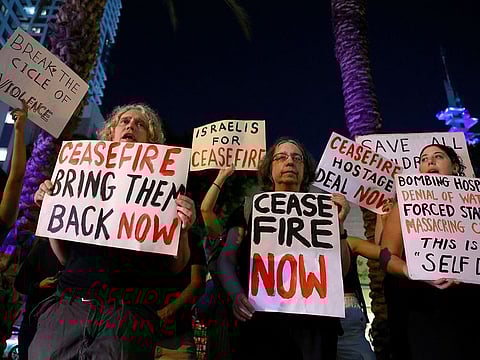 People attend a protest calling for a ceasefire in Gaza.