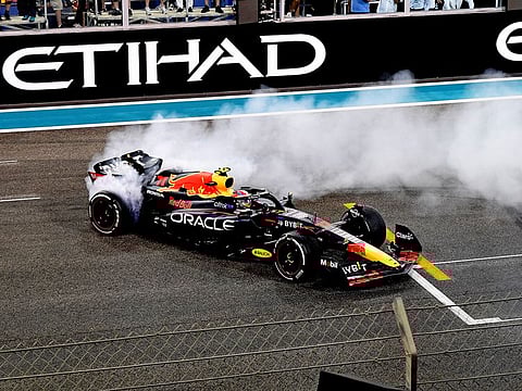 Max Verstappen of Red Bull celebrates after winning the Abu Dhabi Formula One Grand Prix on November 20, 2022. The Dutchman aims his fourth consecutive win in Abu Dhabi.