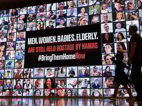 Portraits of Israeli hostages held in Gaza since the October 7 attack by Hamas militants, in Tel Aviv on November 21, 2023.