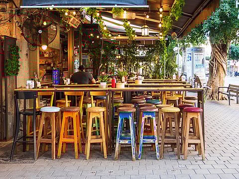 Empty outdoor terrace of typical local street food restaurant bar at Dizengoff Street