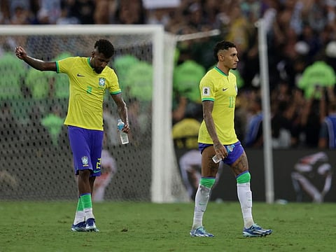 Brazil's Emerson Royal and Raphinha look dejected after the loss to Argentina, their third straight defeat in World Cup qualifiers.