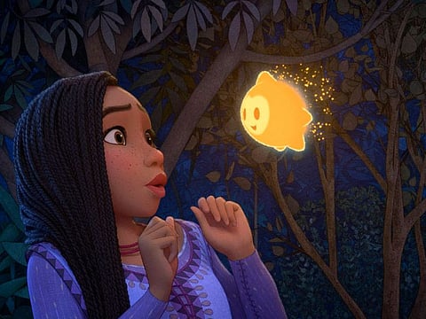 This image released by Disney shows Asha, voiced by Ariana DeBose, in a scene from the animated film "Wish."
