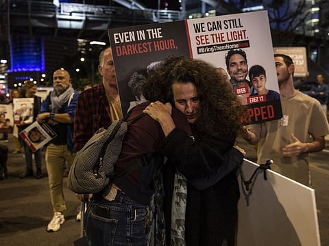 Protesters demand the Israel government agree the release of hostages with Hamas outside the Defence Ministry in Tel Aviv on November 21.