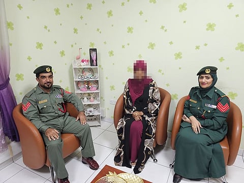 A woman chats with officers at the Naif Police station, who helped resolve a five-year dispute with her husband. The station has a Victim Communication Programme (VCP) team that provides support in accordance with the legal requirements and procedures available to settle disputes that guarantee positive solutions for both parties.