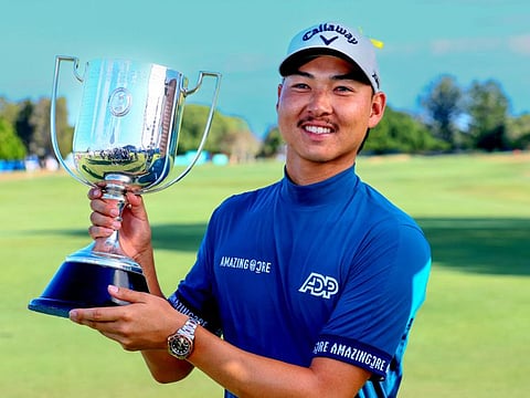 Min Woo Lee of Australia with his trophy following victory on the final day of the Australian PGA Championship at the Royal Queensland Golf Club in Brisbane on Sunday.