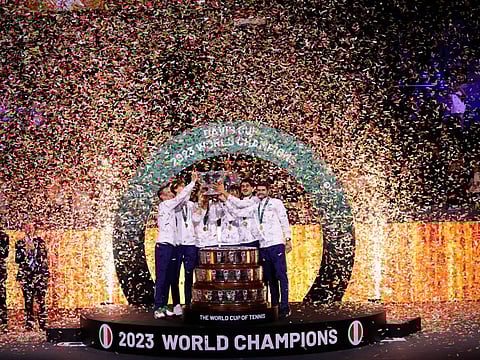The Italian Davis Cup team celebrate with the trophy after defeating Australia during the Davis Cup final in Malaga, Spain on Sunday.