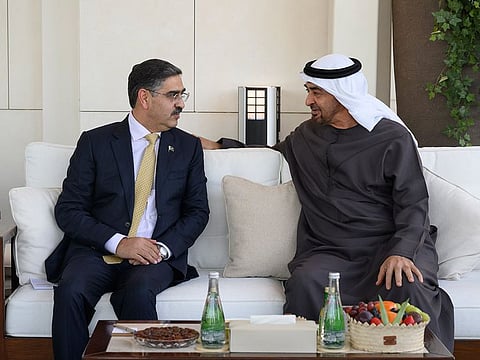 President His Highness Sheikh Mohamed bin Zayed Al Nahyan (right) with Anwaar-ul-Haq Kakar, Prime Minister of the Islamic Republic of Pakistan, at Qasr Al Bahr in Abu Dhabi on Monday