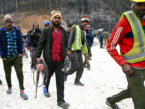 Rescue personnel arrive for manual drilling at the collapsed under construction Silkyara tunnel in the Uttarkashi district of India's Uttarakhand state.