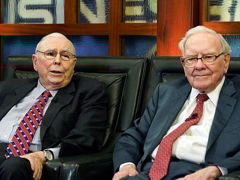 Berkshire Hathaway Chairman and CEO Warren Buffett, right, and his Vice Chairman Charlie Munger, left, speak during an interview in Omaha, Neb., Monday, May 7, 2018,