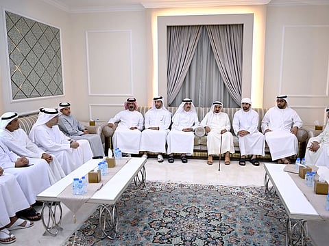 In centre row: His Highness Sheikh Humaid bin Rashid Al Nuaimi, Supreme Council Member and Ruler of Ajman (third from right); His Highness Sheikh Saud bin Rashid Al Mu'alla, Supreme Council Member and Ruler of Umm Al Quwain (third from left); Sheikh Hamdan bin Mohammed bin Rashid Al Maktoum, Crown Prince of Dubai and Chairman of The Executive Council of Dubai (second from right); Sheikh Sultan bin Ahmed Al Qasimi, Deputy Ruler of Sharjah (second from left); Sheikh Ammar bin Humaid Al Nuaimi, Crown Prince of Ajman (left); and Sheikh Rashid bin Saud bin Rashid Al Mu'alla, Crown Prince of Umm Al Quwain (right) during their condolence visit to Abdulrahman bin Mohammad Al Owais, Minister of Health and Prevention (second from top in left row)
