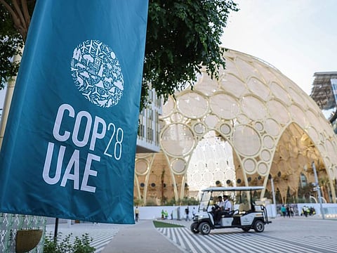 An event banner outside the Green Zone during the COP28 climate conference at Expo City in Dubai, UAE