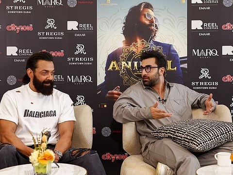 Ranbir Kapoor and Bobby Deol pose for a picture after an interview with 'Gulf News' for their upcoming movie, 'Animal'.