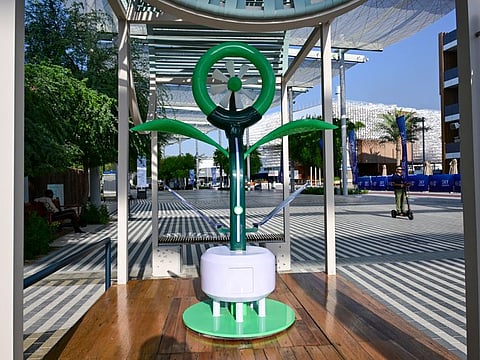 A "Fog Collector"device that can be placed on the side of major highways and roads to collect thick fog, making it safer for drivers by increasing visibility, on display at the COP-28 Green Zone.