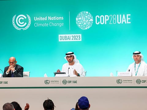 Dr Sultan Al Jaber (centre), COP28 President; Simon Stiell (left), Executive Secretary of the United Nations Framework Convention on Climate Change, and Ambassador Majid Al Suwaidi, COP28 Director-General, addressing media on the opening day of COP28 at Expo City Dubai on Thursday