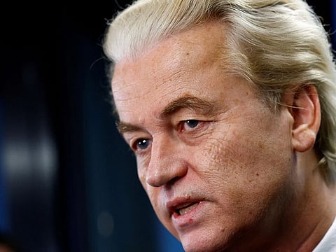 Dutch far-right politician and leader of the PVV party Geert Wilders reacts as he meets the press as Dutch parties' lead candidates meet after elections, in which far-right politician Geert Wilders booked major gains, to begin coalition talks in The Hague, Netherlands