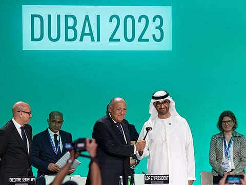 Sameh Shoukry, President of COP 27, welcomes onstage Dr Sultan Ahmed Al Jaber, President of COP 28, during the UNFCCC Formal Opening of COP28 at the UN Climate Change Conference (COP28) at Expo City Dubai on Thursday
