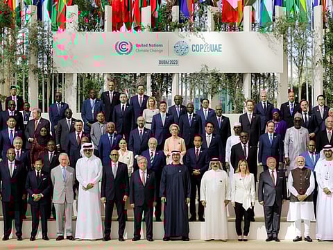 UAE President His Highness Sheikh Mohamed bin Zayed Al Nahyan with world leaders for a group photo at Al Wasl Plaza during the UN Climate Change Conference COP28 at Expo City in Dubai, United Arab Emirates, on December 1, 2023. The World Climate Action Summit started with calls for more diligent efforts to avert a climate crisis.