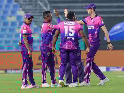 Akeal Hosein of New York Strikers celebrates with teammates after dismissing Kennar Lewis during their Abu Dhabi T10 league match at Zayed Stadium on Friday.