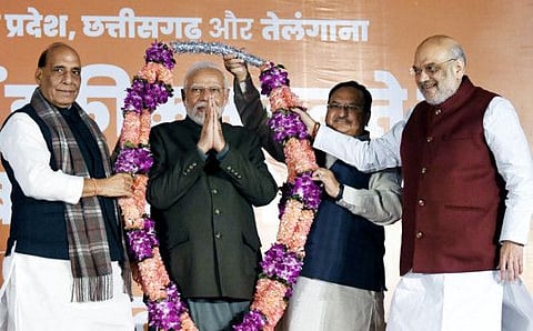 Indian Prime Minister Narendra Modi being garlanded by Home Minister Amit Shah, Defence Minister Rajnath Singh, and BJP President JP Nadda during celebrations of the party's wins Madhya Pradesh and Rajasthan Assembly elections and leads in Chhattisgarh, in New Delhi on December 2, 2023. In the national elections, the party may face backlash from some states that feel alienated or neglected by the Centre’s policies and actions.