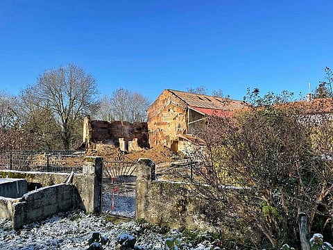 A barn and a house where two bodies were found, after a fire broke out during the night of November 26 and 27 in Chateauvilain, south-eastern France..