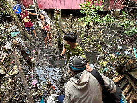 Earthquake-affected residents evacuate from Hinatuan, Surigao del Sur province.
