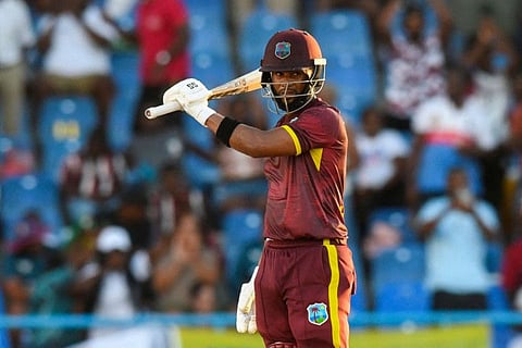 Shai Hope of West Indies celebrates his century during the first One-Day International against England at Sir Vivian Richards Stadium.