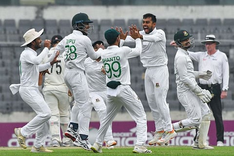 Bangladesh's Mehidy Hasan Miraz (second right) celebrates with teammates the wicket of New Zealand's Tom Blundell during the first day of the second Test cricket at the Sher-e-Bangla National Cricket Stadium in Dhaka on Wednesday.