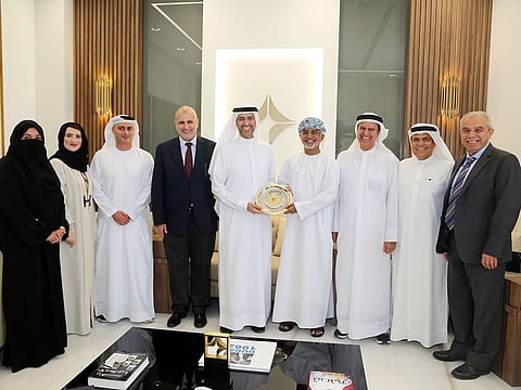 Awad Al Ketbi, Director General of DHA, received the accreditation shield from Dr. Omar Al Rawas, Secretary General of Arab Board of Health Specialisations.