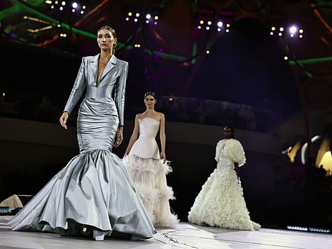Models walk the ramp for the first ever fashion show at COP28, showcasing trash-to-fashion creations, that are not only stunning pieces of work but are designed to be sustainable, keeping in tandem with the goal of promoting climate change and sustainable wear. Picture taken on 6th December, 2023. Photo Clint Egbert/Gulf News