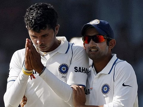 India's Shanthakumaran Sreesanth (L) gestures as he celebrates taking the wicket of Sri Lanka's Rangana Herath as team mate Gautam Gambhir congratulates him during the third day of their second test cricket match in Kanpur November 26, 2009. REUTERS/Adnan Abidi (INDIA SPORT CRICKET)