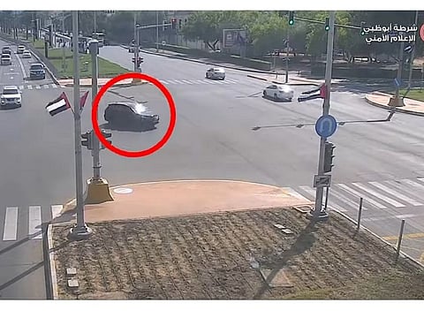 A screengrab from the video shared by Abu Dhabi police showing moments before a smashup at an intersection due to distracted driving.
