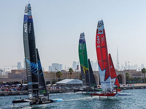 New Zealand, Australia and Canada in action as they sail closely past the Race Village on Race Day 1 of the Dubai SailGP on Saturday.
