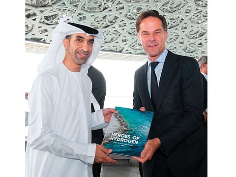 Dr Thani bin Ahmed Al Zeyoudi, UAE Minister of State for Foreign Trade, receives the book Heroes of Hydrogen from Mark Rutte, Prime Minister of the Netherlands during the latter’s visit to the UAE in September this year
