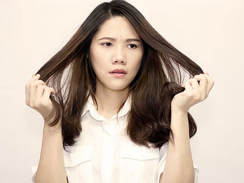 In moments of heightened stress or unease, people resort to twirling their hair as a soothing mechanism.