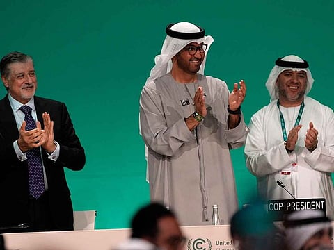 COP28 President Sultan Al Jaber, centre, claps after passing the global stocktake at the COP28 UN Climate Summit, Wednesday, December 13, 2023, in Dubai, United Arab Emirates.