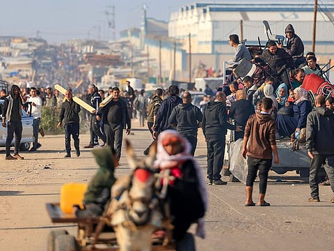 Palestinians flee from Khan Younis to Rafah in the southern Gaza Strip after the Israeli army called on people to leave certain areas in the city.