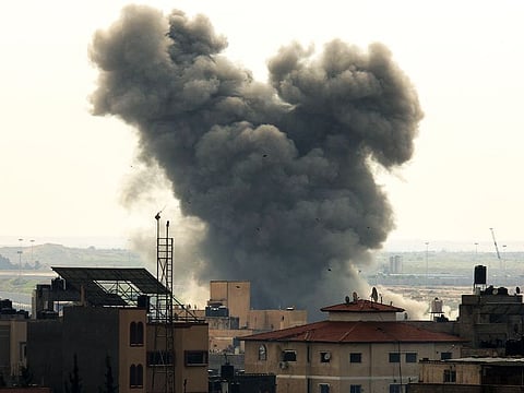 Smoke billows following Israeli strikes in Rafah near the Palestinian Egyptian border in the southern Gaza Strip on December 14, 2023