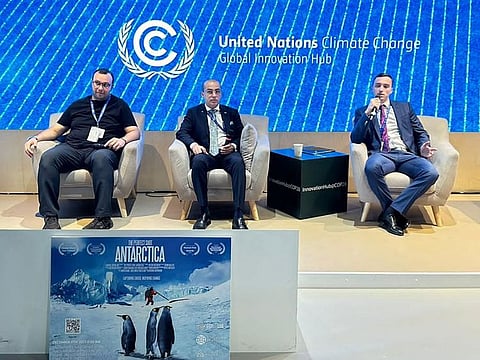 Producers Habib Paracha (2nd L) with Artem Shestakov (R) and Kadir S. Gungor during the premier of documentary 'The Perfect Shot: Antarctica' at COP28, Expo City Dubai