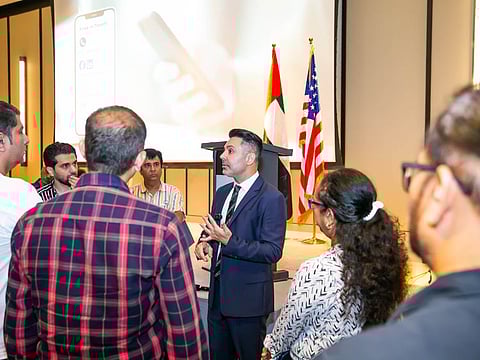 Shai Zamanian, Legal Director, The American Legal Center addresses visitors at a U.S. EB-5 session