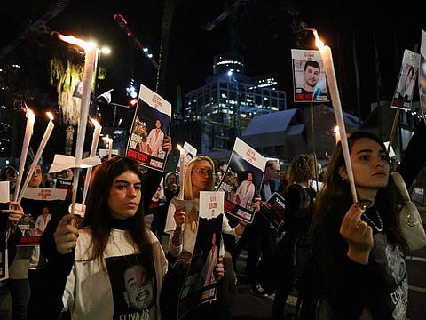 Israelis hold candles at a demonstration in Tel Aviv, Israel