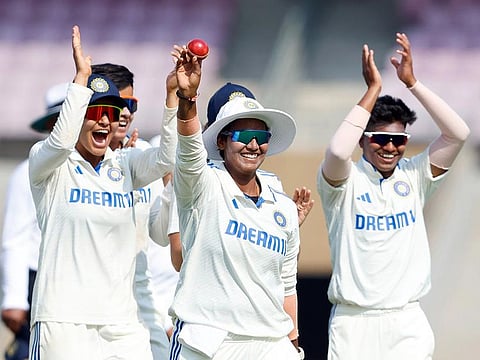 India Women's Deepti Sharma and teammates celebrate her five-wicket haul during Day 2 of the One-off Test match against England Women, at Dr DY Patil Sports Academy in Navi Mumbai on Friday.