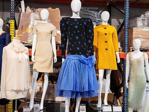 Princess Diana’s 1981 engagement portrait blush pink chiffon Emanuels blouse (left) and Jacques Azagury 1985 ballerina-length evening dress (centre) are displayed during Julien's Auction's press preview ahead of the public exhibition and auction “Hollywood Legend” presented by Julien’s Auction and Turner Classic Movies (TMC) at Julien's Auction in Gardena, California.