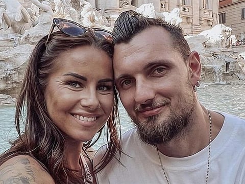 PSG football club goalkeeper Alexandre Letellier (right) with his wife.