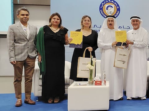 (From R): Dr Eesa Mohammed Al Al Bastaki. Abdulqader Obaid Ali, Dr Yaprak Anadol, Sameera Fernandes and Sharad V K during the launching of personal finance guide for blue-collar workers.
