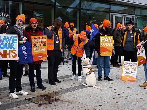 Junior doctors strike on a picket line outside the Queen Elizabeth Hospital in Birmingham on December 20, 2023.