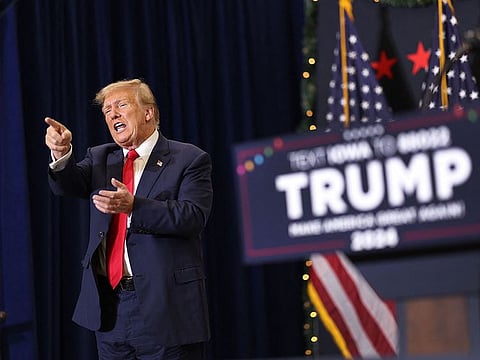 Republican presidential candidate and former U.S. President Donald Trump gestures as he wraps up a campaign event on December 19, 2023 in Waterloo, Iowa. Iowa Republicans will be the first to select their party's nomination for the 2024 presidential race, when they go to caucus on January 15, 2024