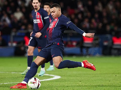Paris Saint-Germain's French forward Kylian Mbappe shoots the ball during a match against FC Metz at the Parc des Princes stadium in Paris on Wednesday.
